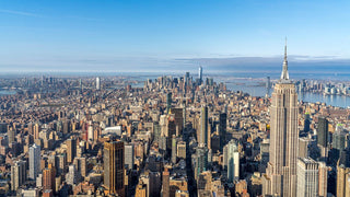 Aerial view of a cityscape with the Empire State Building in New York City.