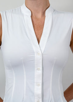 White sleeveless blouse with buttons on a plain background